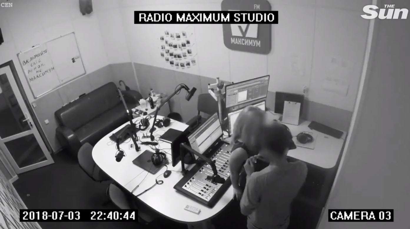 Randy news announcer busted on CCTV showing his missus some “breaking news”