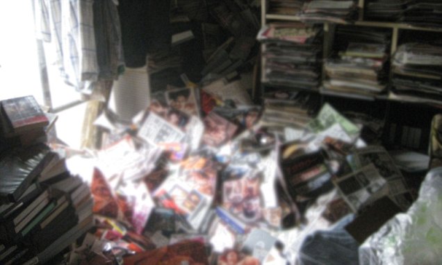 Man dies after massive stack of porn magazines falls on him