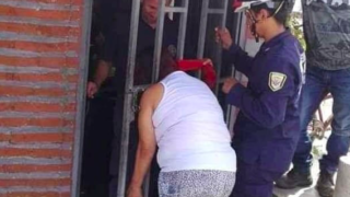 Sheila gets head stuck in gate while trying to spy on the neighbours
