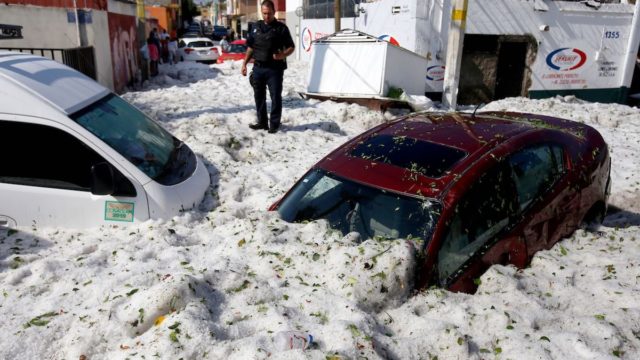 Photos show freak hailstorm during summer with 5ft of ice on Mexican roads