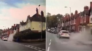 Speeding Audi driver deliberately swerves into puddle to splash mother and son