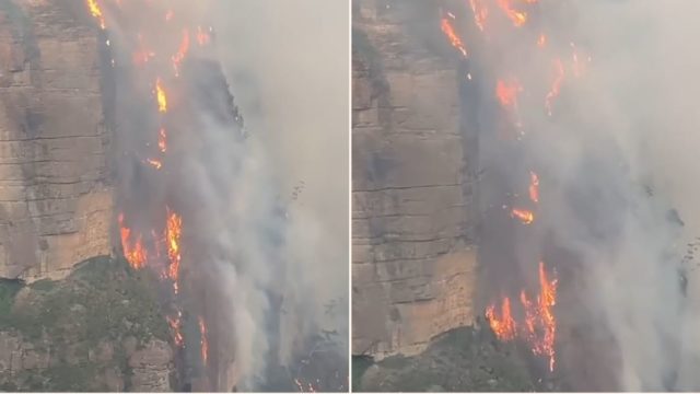 Flames ‘like a waterfall’ rage 200m up a cliff in Australian bushfires
