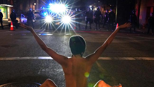 Protesters nude stand off goes viral