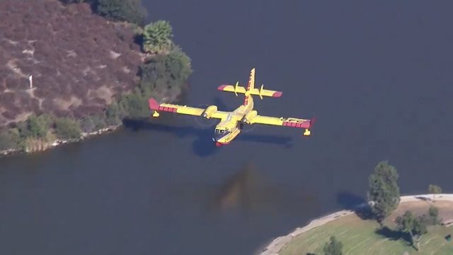 The epic piloting of this water-bomber plane has drawn world wide attention