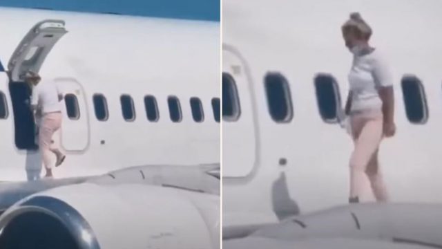 Woman walks out on the wing of plane after complaining it was too hot