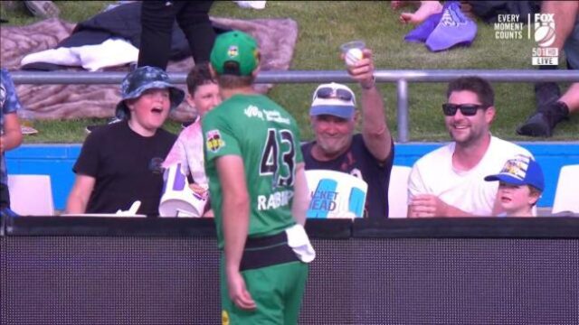 Bloke catches ball in beer cup at the Cricket – does what any good Aussie should