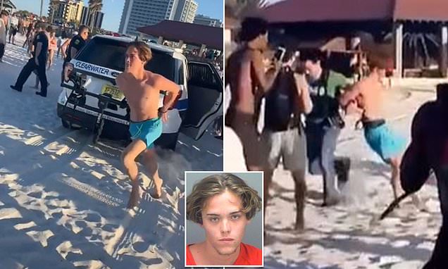 Arrested Spring Breaker cheered on by beachgoers as he flees cops in handcuffs