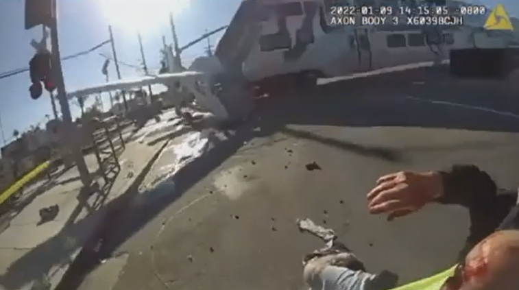 Hectic video shows LAPD rescuing bloke from crashed plane – seconds before train collision