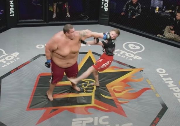 Female strawweight star fights enrmous male heavyweight in mismatch MMA bout