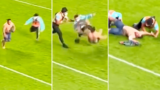 “Never seen that”: Fans erupt over “brutal” hit on pitch invader